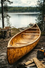 Handcrafted wooden canoe at lakeside workshop nature scene outdoor craftsmanship scenic viewpoint