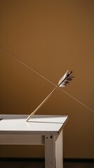 Arrow on white table and beige background
