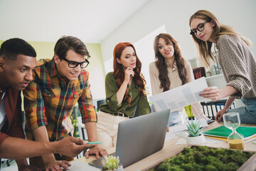 Photo of nice young people software developer working together comfortable modern office loft room...