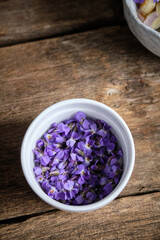 viola flowers on wooden background	
