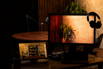 Podcast recording setup featuring microphones and headphones in a stylish studio environment