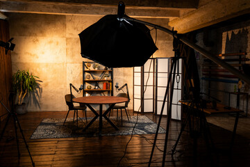 Podcast recording setup featuring microphones and lighting in a cozy studio environment