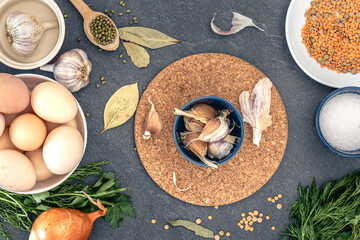 Cooking background. Ingredients for cooking. Eggs, cereals, garlic, spices, parsley.