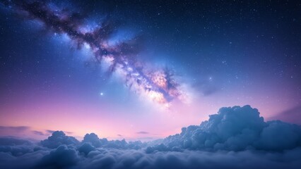Obraz premium The Milky Way stretches across the starry sky above a cloud-filled landscape. The nebula clouds and stars shine brightly, creating a magical and serene view of the cosmic universe.