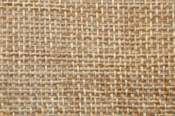 Light beige or yellow natural texture of rough linen textile material background. Fabric canvas
