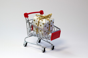 Gift box packed in dotted craft paper and tied with a twine, ecological packaging, recycled paper,...