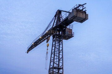 Naklejka premium Industrial crane against the sky