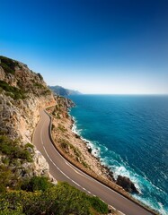 A detailed shot of a winding coastal road along the cliffs, with the road leading toward the horizon, offering stunning views of the ocean and dramatic cliffs.