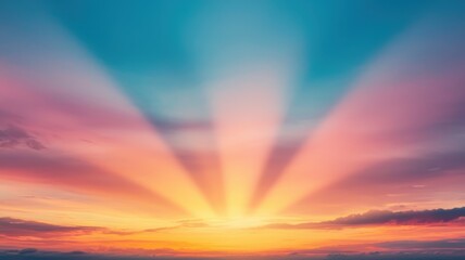 Obraz premium A stunning sunset displays vibrant colors with radiant beams spreading across the sky, creating a serene and picturesque scene.