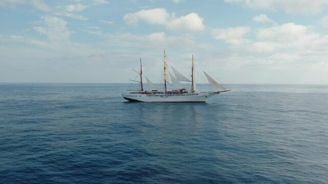 Sea cloud luxury cruise ship sailing vessel in the Atlantic Ocean under clear blue sky, Aerial