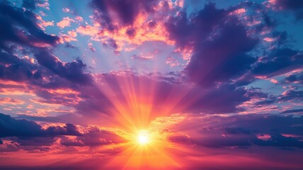 Fototapeta premium A stunning sunset with vibrant colors illuminating the sky, radiating warmth and beauty through fluffy clouds.