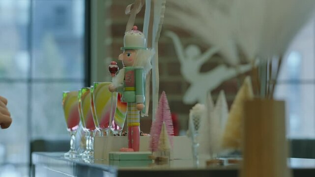 Pastel Nutcracker in a Festive Ballet-Themed Holiday Display