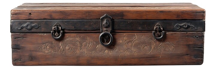 Rustic wooden chest with iron hinges and faded carvings isolated