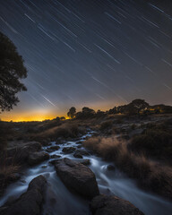 night sky, flowing stream, long exposure, stars, starry night, astrophotography, celestial beauty, dark sky, twinkling stars, cosmic scenery, night photography, galaxy view, peaceful night, dreamy lan