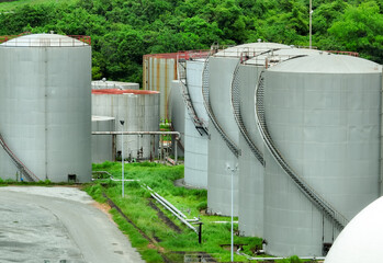 Large gas storage tanks at an oil refinery and petrochemical plant. Industrial pipelines and energy...
