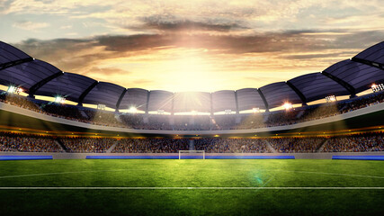 Wide-angle of large modern stadium filled with enthusiastic fans. Green football field under...