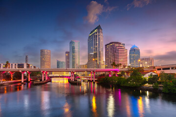 Tampa, Florida, USA. Cityscape image of Tampa, Florida with reflection of the city skyline in the water at beautiful sunrise.