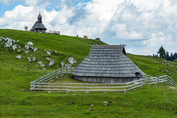 Velika Planina, Kamnik, Slovenia. Lord of the Rings style village. Wooden typical houses, hills,...