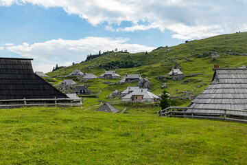 Velika Planina, Kamnik, Slovenia. Lord of the Rings style village. Wooden typical houses, hills,...