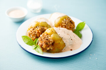 Stuffed peppers with beef, rice and sour cream sauce