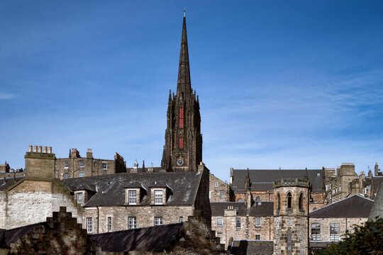 Historic Edinburgh architecture under blue sky - Powered by Adobe