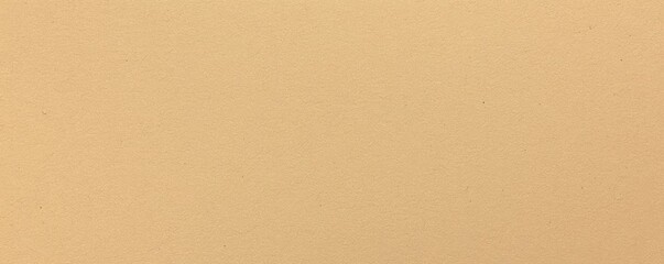 Fototapeta premium A solid, muted beige background with a smooth texture, conveying warmth and neutrality.