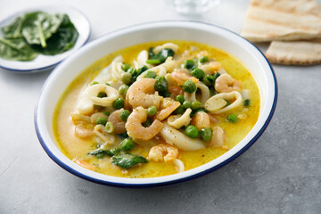 Seafood curry with green pea and spinach
