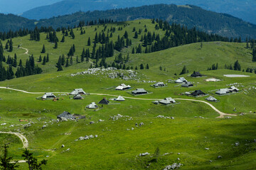 Velika Planina, Kamnik, Slovenia. Lord of the Rings style village. Wooden typical houses, hills,...