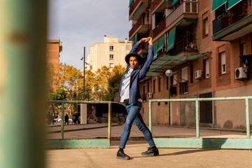 Young man moving and dancing outdoors
