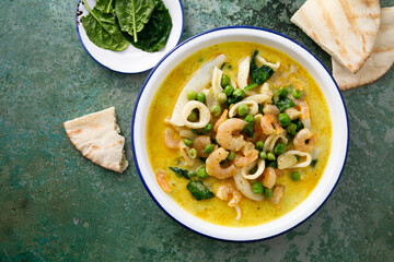Seafood curry with green pea and spinach