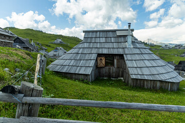 Velika Planina, Kamnik, Slovenia. Lord of the Rings style village. Wooden typical houses, hills,...