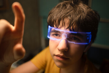 Teenager wearing smart glasses interacting with virtual interface indoors