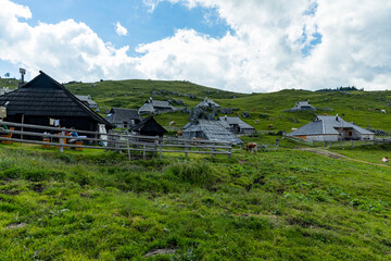 Velika Planina, Kamnik, Slovenia. Lord of the Rings style village. Wooden typical houses, hills,...
