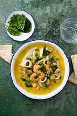 Seafood curry with green pea and spinach