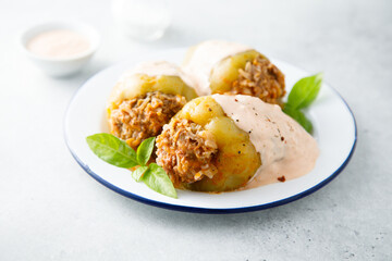 Stuffed peppers with beef, rice and sour cream sauce