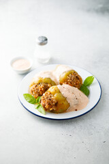 Stuffed peppers with beef, rice and sour cream sauce
