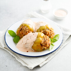 Stuffed peppers with beef, rice and sour cream sauce
