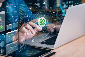Businessman interacting with a digital interface displaying sustainability with Go Greenon concepts.The image conveys themes of eco-friendly, environmental sustainability in business.not ai generated

