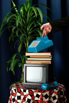 Retro office setup with vintage phone and TV on a decorated table