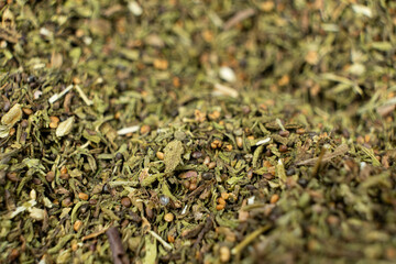 Organic dried savory leaves spice macro.