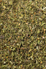 Organic dried savory leaves spice macro.