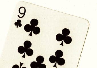 Close up of a playing card in sepia.