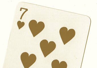 Close up of a playing card in sepia.