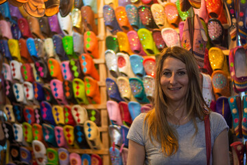 the amused girl among all the colors of the souk