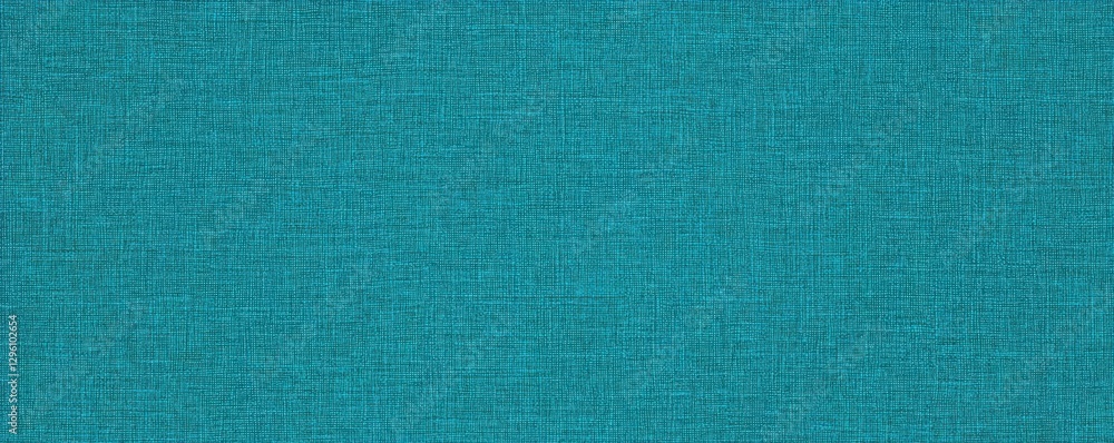 Poster a textured teal fabric background with a subtle woven pattern, evoking a sense of depth and richness