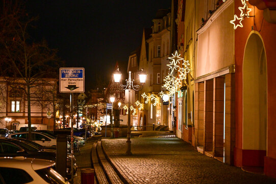The picturesque historic old town of Kulmbach at night, with atmospheric street lighting, traditional facades, and cobblestone streets, Upper Franconia, Bavaria, Germany