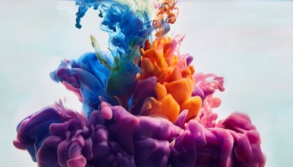 Obraz premium Close-up ink drops in water: colorful plumes spread, bloom. Abstract fluid art, mesmerizing