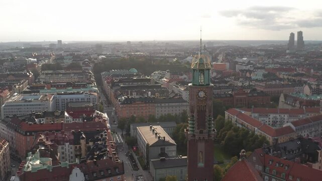 Engelbrektskyrkan in &Ouml;stermalm, Stockholm, Sweden during sunny evening in the summer. Aerial shot orbiting church and panning to the left, Stockholm-skyline in background with Norra Tornen visible.