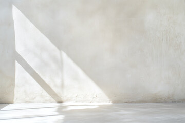 Lightly sanded white plaster wall with soft shadows creating serene atmosphere. minimalist design enhances space tranquility and elegance
