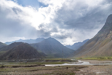 Fototapeta premium Himalayan mountain view at Mughalpura with the Drass River in Ladakh. It is on NH 1 near the Mina Marg Check Post in the union territory of Ladakh in India.